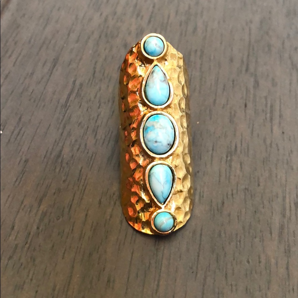 Stunning gold ring with turquoise-colored stones